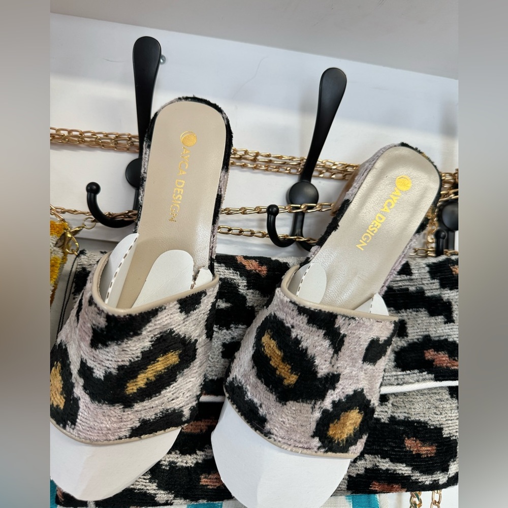 NWT velvet leopard print slides .